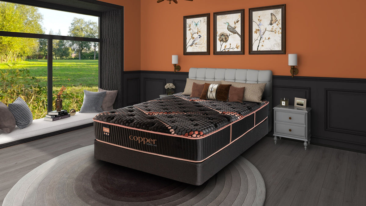 Spring Air Copper Quilted Hybrid Medium Mattress — bedroom setting.