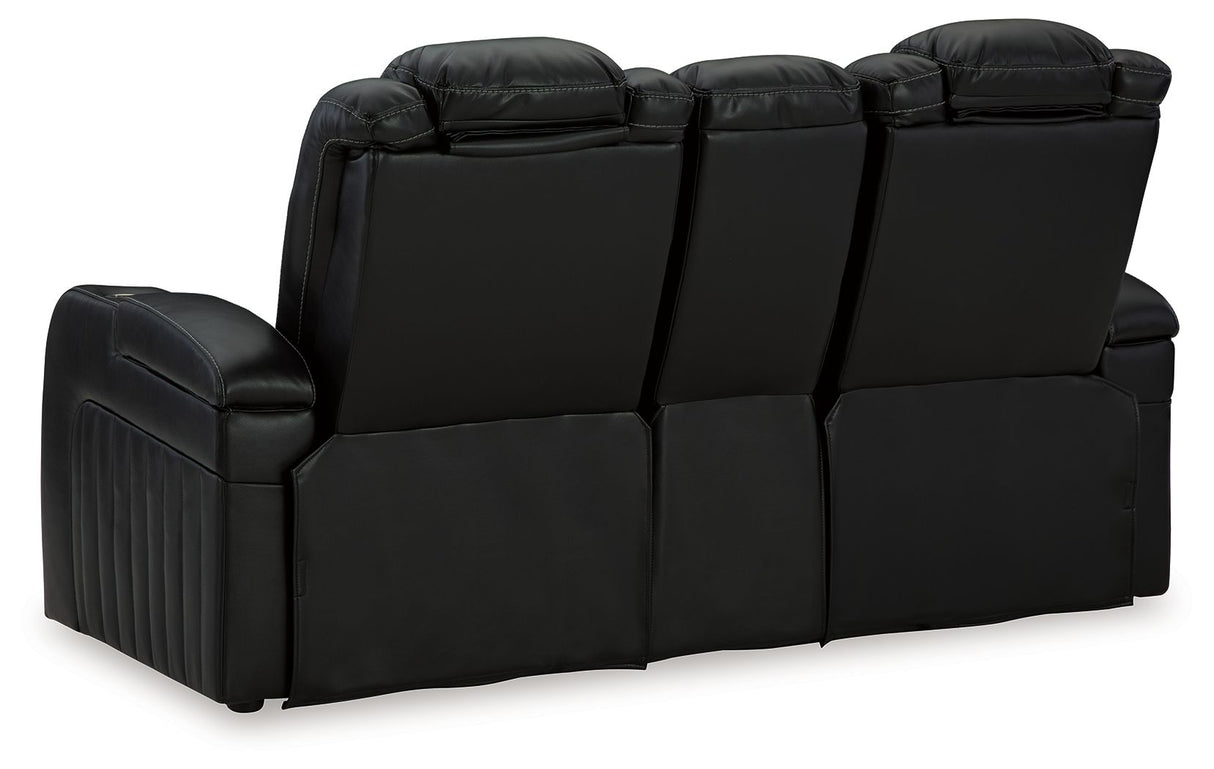 Caveman Den - Power Reclining Loveseat with Console/ Adj Hdrst - Midnight