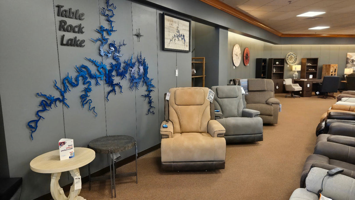 Recliners beside the Table Rock Lake wall art in Neill’s Branson showroom