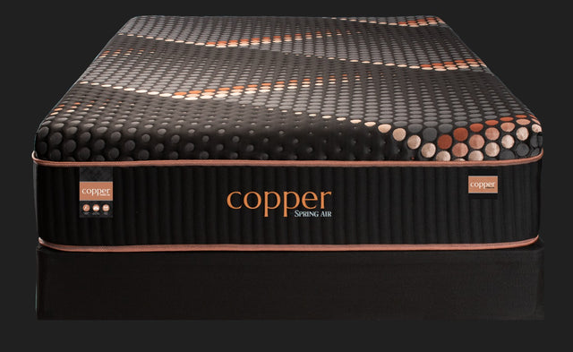 Front view of a standard Copper Smooth Top hybrid mattress on a foundation.