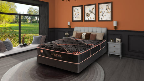 Spring Air Copper Quilted Hybrid Medium Mattress — bedroom setting.